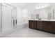 Bright bathroom with a walk-in shower, soaking tub, and modern vanity with double sinks at 5136 Stonecrop St, North Las Vegas, NV 89031