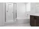 Bright bathroom showcasing a walk-in shower and soaking tub with modern fixtures and bright white tile at 5136 Stonecrop St, North Las Vegas, NV 89031
