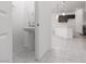 Bathroom featuring modern pedestal sink and neutral tiling at 5136 Stonecrop St, North Las Vegas, NV 89031