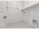 A bright walk-in closet featuring wire shelving and tile flooring at 5136 Stonecrop St, North Las Vegas, NV 89031