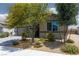 Charming single-story home showcasing lovely desert landscaping and a gray garage door at 5136 Stonecrop St, North Las Vegas, NV 89031