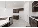 Bright kitchen featuring a spacious island with quartz countertops and stainless steel appliances at 5136 Stonecrop St, North Las Vegas, NV 89031