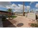 Expansive backyard features gravel landscaping, palm trees, a storage shed, and a covered patio at 517 Scenic Terra Dr, Henderson, NV 89015