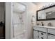 Bathroom featuring a walk-in shower with modern fixtures and a white double vanity at 517 Scenic Terra Dr, Henderson, NV 89015