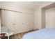 Neutral bedroom with modern vinyl floors, closet and blue bedding at 517 Scenic Terra Dr, Henderson, NV 89015