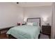 Well-lit bedroom features a cozy bed, chair, nightstands, and serene window view at 517 Scenic Terra Dr, Henderson, NV 89015