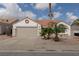 Charming single-story home featuring a two-car garage, desert landscaping, and a classic terra cotta roof at 517 Scenic Terra Dr, Henderson, NV 89015
