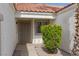 Front porch featuring a decorative security door and privacy landscaping at 517 Scenic Terra Dr, Henderson, NV 89015