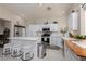 Kitchen features white cabinets, stainless steel appliances, breakfast bar with seating at 517 Scenic Terra Dr, Henderson, NV 89015