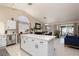 Open-concept kitchen with large island, stainless dishwasher, and access to dining and living areas at 517 Scenic Terra Dr, Henderson, NV 89015