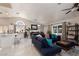 Open-concept living room and kitchen space featuring a vaulted ceiling, tile flooring, and natural light at 517 Scenic Terra Dr, Henderson, NV 89015