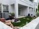 Cozy backyard and patio with artificial grass and gardening area at 5201 S Torrey Pines Dr # 1253, Las Vegas, NV 89118