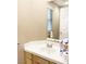 Bathroom sink with tile countertop and window for natural light at 5201 S Torrey Pines Dr # 1253, Las Vegas, NV 89118