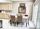 Bright dining area with seating for six and sliding doors leading to the outside at 5201 S Torrey Pines Dr # 1253, Las Vegas, NV 89118