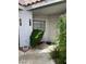 A welcoming home entrance with desert landscaping and security door at 5201 S Torrey Pines Dr # 1253, Las Vegas, NV 89118