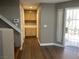 Bright entryway boasts wood laminate flooring, storage, and security screen door at 5201 S Torrey Pines Dr # 1253, Las Vegas, NV 89118