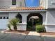 Inviting courtyard entrance with lush landscaping and tile roof at 5201 S Torrey Pines Dr # 1253, Las Vegas, NV 89118