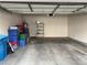 Spacious two-car garage with painted walls, shelving unit, and ample room for storage at 5201 S Torrey Pines Dr # 1253, Las Vegas, NV 89118