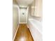 Hallway featuring hardwood floors, cabinetry, and neutral paint at 5201 S Torrey Pines Dr # 1253, Las Vegas, NV 89118