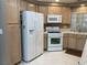 Efficient kitchen with white appliances, ample storage, and natural light at 5201 S Torrey Pines Dr # 1253, Las Vegas, NV 89118