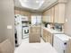 Well-lit kitchen featuring tile countertops and plenty of cabinet space at 5201 S Torrey Pines Dr # 1253, Las Vegas, NV 89118