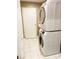 Bright laundry room with stacked washer and dryer, designed for space-saving efficiency at 5201 S Torrey Pines Dr # 1253, Las Vegas, NV 89118