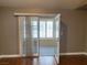 Living room featuring hardwood floors and access to the outdoor patio at 5201 S Torrey Pines Dr # 1253, Las Vegas, NV 89118