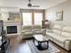 Cozy living room with fireplace, ceiling fan and hardwood floors at 5201 S Torrey Pines Dr # 1253, Las Vegas, NV 89118