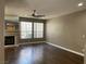 Cozy living room offers wood laminate flooring, a fireplace, and natural lighting at 5201 S Torrey Pines Dr # 1253, Las Vegas, NV 89118