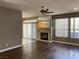 Comfortable living room showcasing a fireplace, patio access, and modern ceiling fan at 5201 S Torrey Pines Dr # 1253, Las Vegas, NV 89118