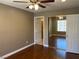 Main bedroom featuring hardwood floors, ceiling fan, and mirrored closet doors at 5201 S Torrey Pines Dr # 1253, Las Vegas, NV 89118