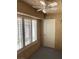 View of outdoor patio featuring three shuttered windows and door to outside at 5201 S Torrey Pines Dr # 1253, Las Vegas, NV 89118