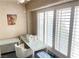 Bright sunroom featuring shuttered windows, a desk, and a comfortable chair at 5201 S Torrey Pines Dr # 1253, Las Vegas, NV 89118