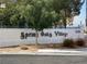 Spring Oaks Village community sign with trees and flowerbeds at 5201 S Torrey Pines Dr # 1253, Las Vegas, NV 89118