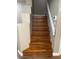 View of wooden staircase with white banister at 5201 S Torrey Pines Dr # 1253, Las Vegas, NV 89118
