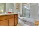 Bathroom featuring a shower with glass doors, granite countertops, and a wooden vanity at 5250 S Rainbow Blvd # 1084, Las Vegas, NV 89118