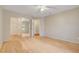 Bedroom with hardwood flooring, ample lighting, and closet space at 5373 Painted Mirage Rd, Las Vegas, NV 89149