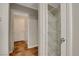 Hallway with access to utility room and pantry featuring wire rack shelves at 5373 Painted Mirage Rd, Las Vegas, NV 89149