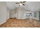 Large living area with tile flooring, high ceilings, and open access to other living spaces at 5373 Painted Mirage Rd, Las Vegas, NV 89149