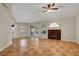 Comfortable living room with tile floors, a fireplace, and access to the backyard through sliding doors at 5373 Painted Mirage Rd, Las Vegas, NV 89149