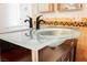 Close-up on the modern glass bowl sink and stylish faucet in the bathroom at 5516 Orchard Ln # 0, Las Vegas, NV 89110