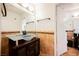 Bathroom features a glass bowl sink and an intricate brown tiled backsplash at 5516 Orchard Ln # 0, Las Vegas, NV 89110