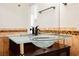 Elegant bathroom featuring a unique glass bowl sink and sleek black fixtures at 5516 Orchard Ln # 0, Las Vegas, NV 89110