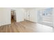The bedroom features an ensuite bathroom and sliding glass door to private balcony at 5516 Orchard Ln # 0, Las Vegas, NV 89110