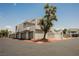 Modern condo building with attached garages, clean lines, and desert landscaping for a stylish curb appeal at 5516 Orchard Ln # 0, Las Vegas, NV 89110