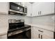 Modern kitchen featuring stainless steel appliances, quartz countertops and white subway tile backsplash at 5516 Orchard Ln # 0, Las Vegas, NV 89110