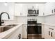 Modern kitchen featuring stainless steel appliances, quartz countertops, and white subway tile backsplash at 5516 Orchard Ln # 0, Las Vegas, NV 89110