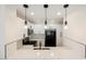 The kitchen is equipped with stainless steel appliances and marble countertops, and pendant lighting at 5516 Orchard Ln # 0, Las Vegas, NV 89110