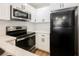 This kitchen features stainless steel appliances, white cabinets, and a subway tile backsplash at 5516 Orchard Ln # 0, Las Vegas, NV 89110