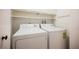 Laundry room with a side-by-side washer and dryer and overhead storage at 5516 Orchard Ln # 0, Las Vegas, NV 89110